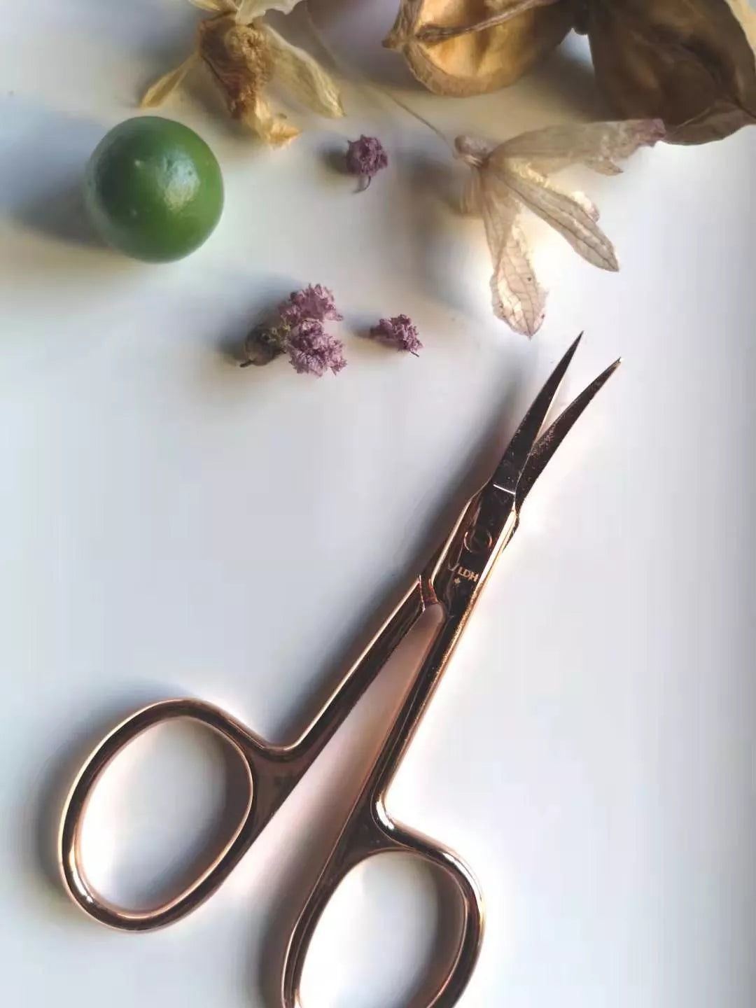 Rose gold metal scissors with durable construction and sharp blades for precision cutting