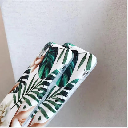 Retro floral iPhone case with banana leaf and flowers design in leaves colour on a soft TPU back cover.