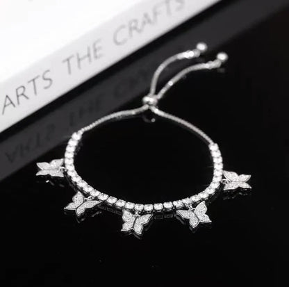 Elegant copper bracelet with delicate butterfly motifs and sparkling zircon accents