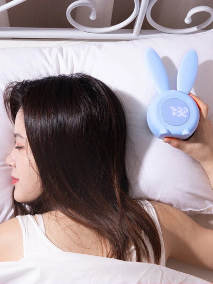 Adorable bunny-eared LED alarm clock with sound control, available in blue, green, and pink colors