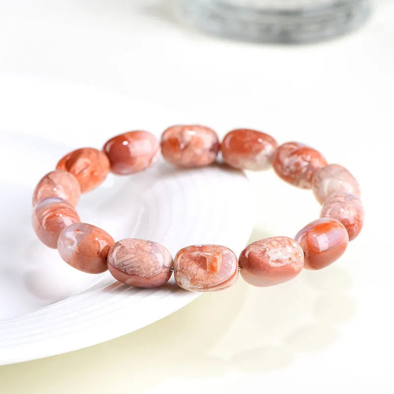 Natural cherry agate barrel bead bracelet with 10x14mm geometry design and Ruyi elements on wrist