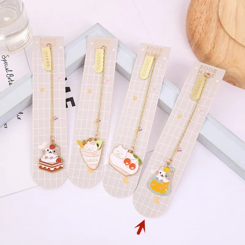 Jane Lime Foodie cat creative metal bookmark with cartoon pendant on a book page.
