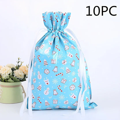 Christmas gift bag with drawstring closure in laser gold finish, 32x24cm dimensions