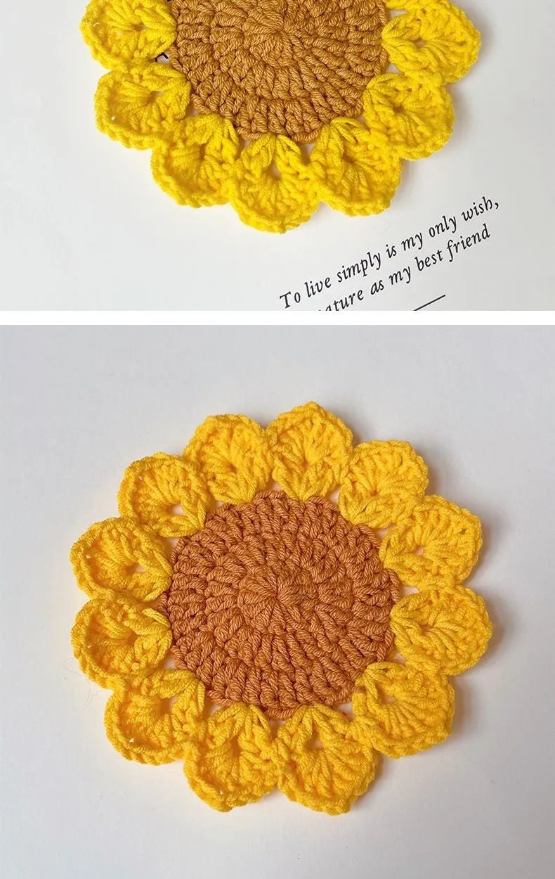 Hand-woven wool flower coaster on a wooden table