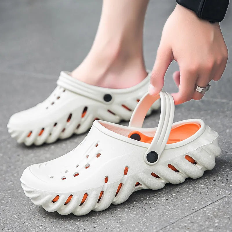 Men's beige slipper sandals with hollow-out design and textured non-slip sole, side view.