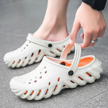 Men's beige slipper sandals with hollow-out design and textured non-slip sole, side view.