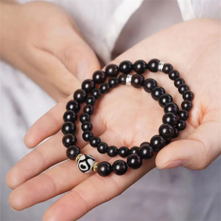 Unisex Ebony Wood Bracelet with Tibet Beads Design Measuring 8mm Wide Featuring Two Dark Brown Circles and Retro Tibetan-Inspired Beadwork for Men and Women