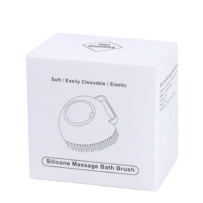 Blue silicone dog bath and massage brush held in a hand.