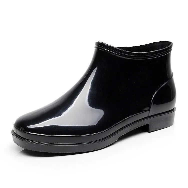 Black short-tube men's rain boots with non-slip plastic sole and PVC upper, sizes 36-50.