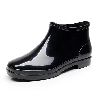 Black short-tube men's rain boots with non-slip plastic sole and PVC upper, sizes 36-50.