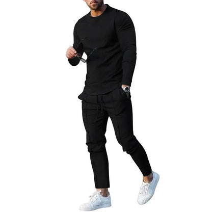 Men's light grey polyester two-piece suit set with long sleeve round neck T-shirt and matching trousers.