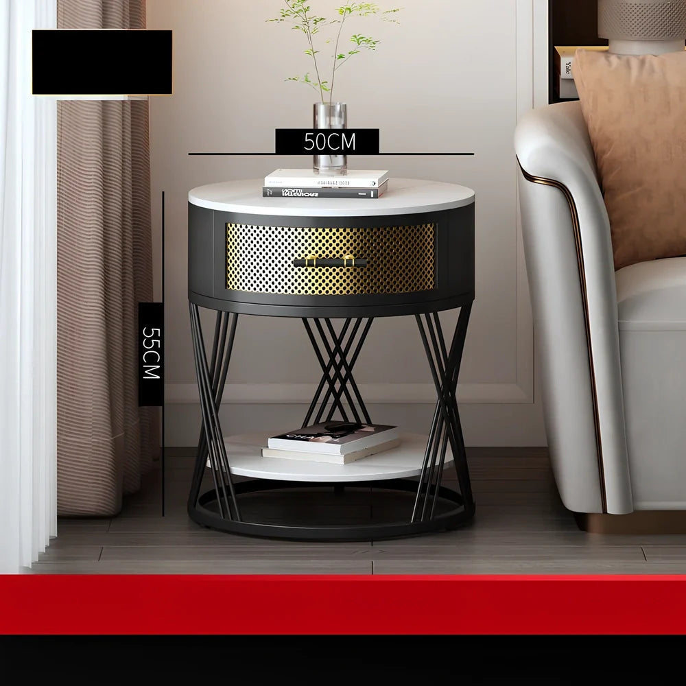 Round coffee table with slate surface and metal frame, featuring integrated storage compartment