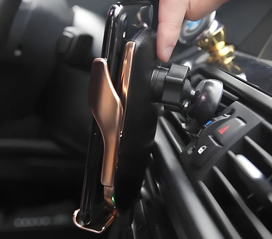 Black car wireless charger phone holder with suction cup mount and 360-degree rotation on a dashboard