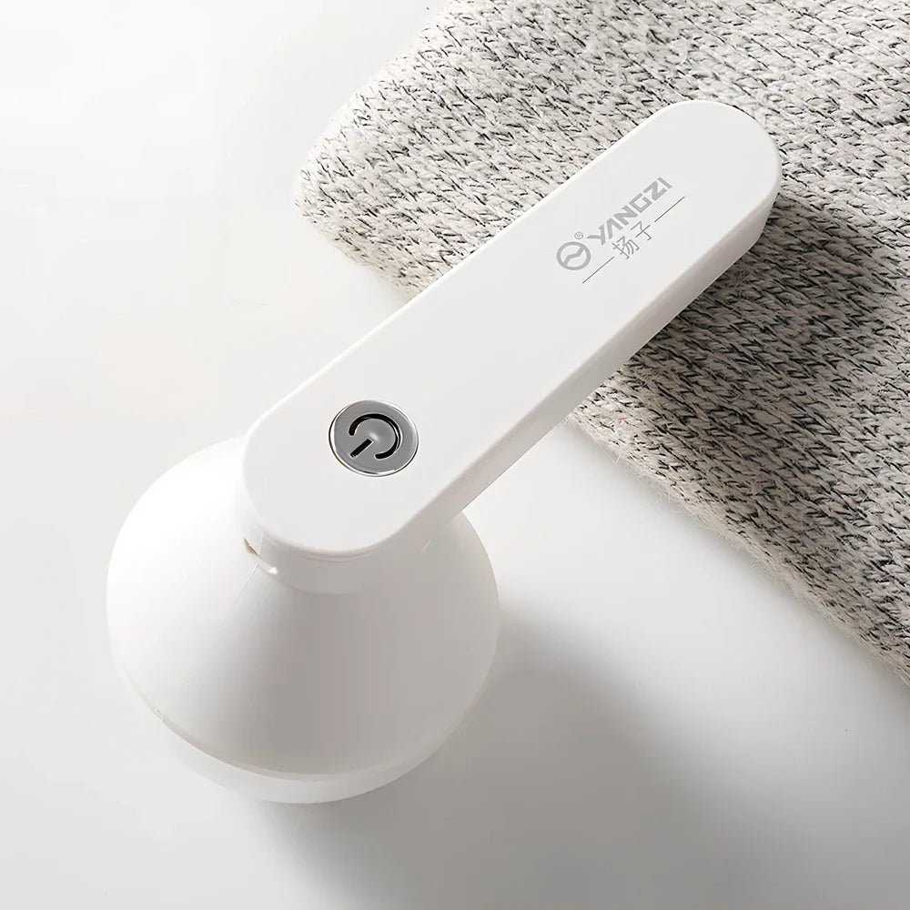 White and green charging shaving machine with straight plug design measuring 13.5cm