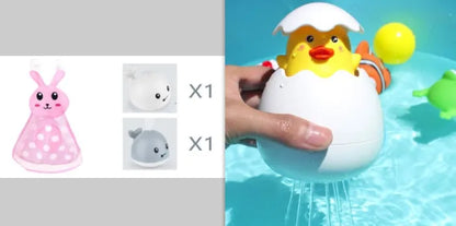 Automatic water-spraying whale bath toy with colourful lights floating in bath water.