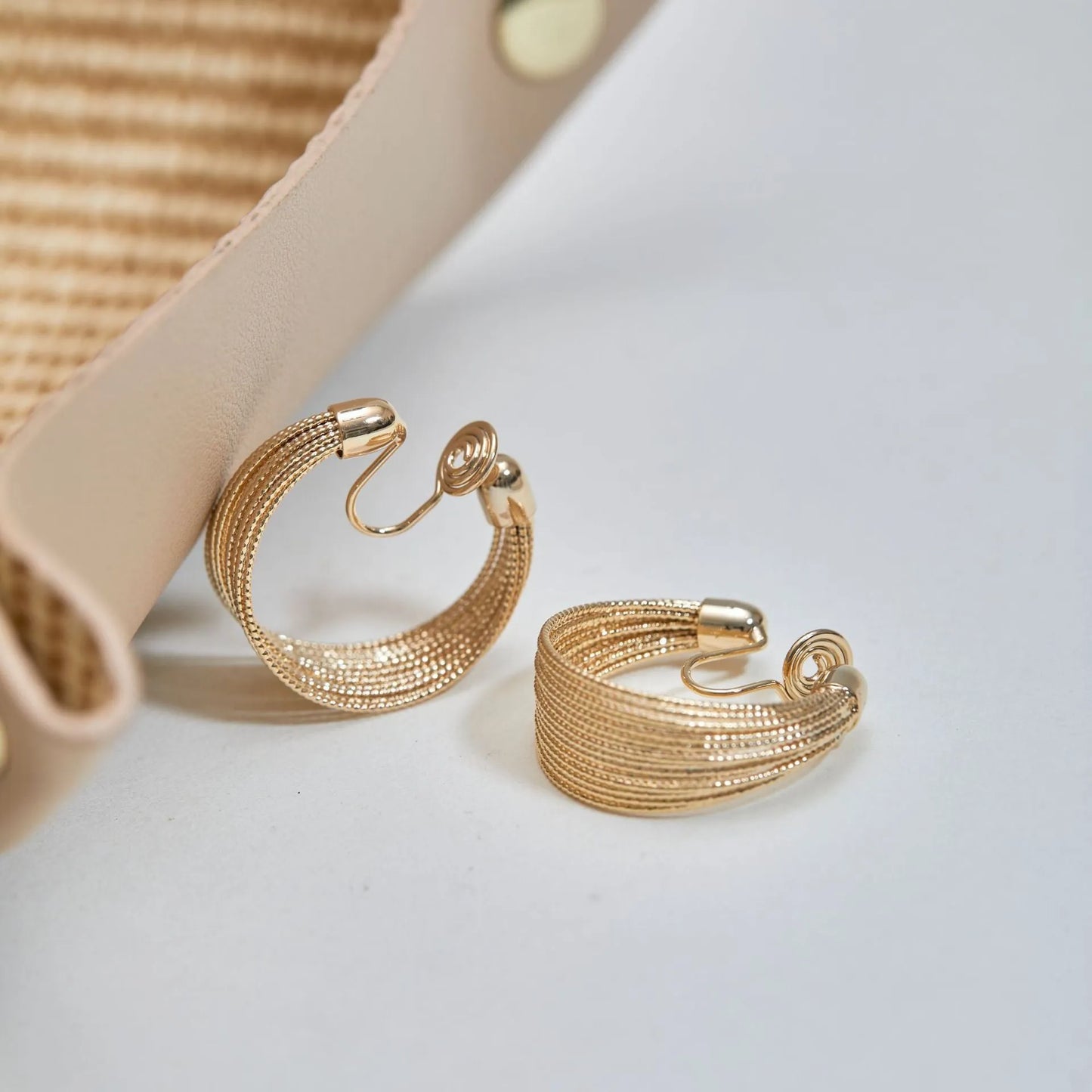 Geometric copper earrings set with gold and silver electroplated finish showing clip and stud options