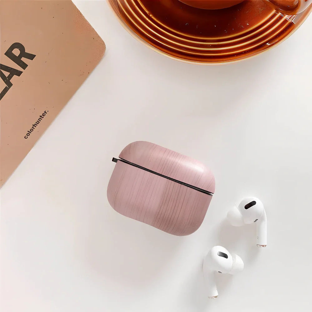 Wood grain AirPods case with IMD clamshell design showing six colour options including dark brown and red brown patterns