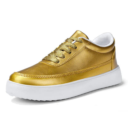 Women's lightweight leather flat casual shoes in gold colour with front lace-up design on a white background