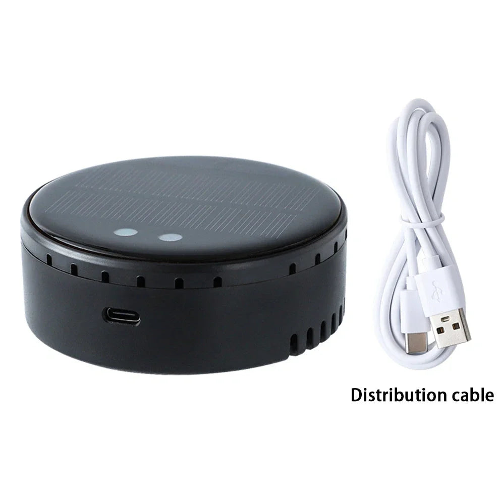 Black solar-powered car humidifier mounted on air conditioning vent with water mist visible