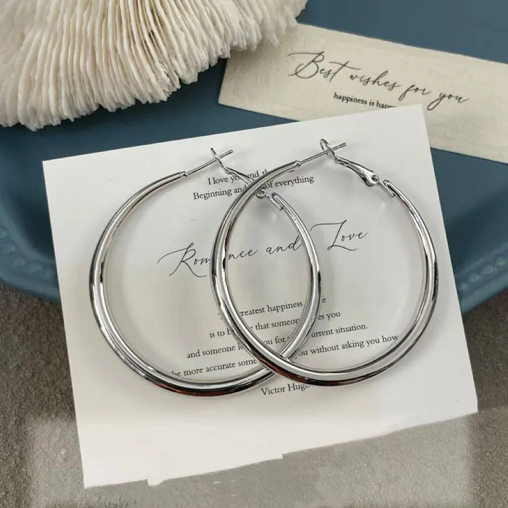 Silver pigment ring earrings with 5cm circular designs on 925 silver posts