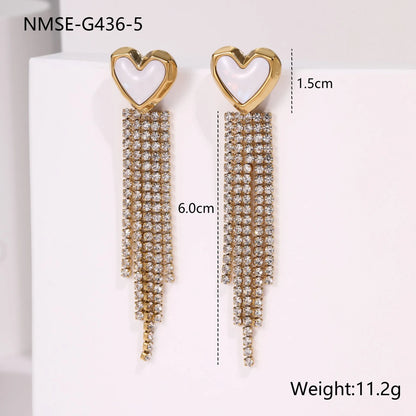 Gold-coloured women's earrings with a love heart shape, star details and dangling diamond-style tassels on a white background.