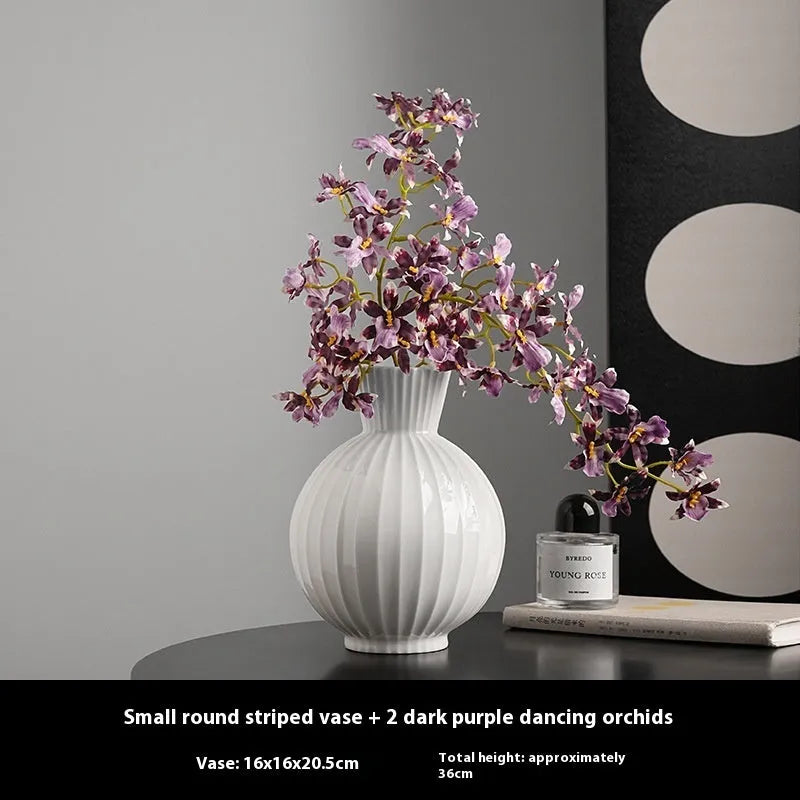 White ceramic ball-shaped vase with striped pattern, shown in small and large sizes with orchid arrangements
