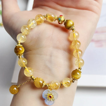 Citrine crystal bracelet with handmade flower tassel on wrist