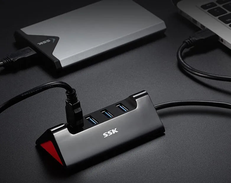 USB computer multi-interface expansion dock in black ABS plastic with four USB ports supporting USB 3.0 and USB 2.0 connectivity for laptop or desktop computers with compact 100mm by 50mm by 31mm dimensions and power via Micro USB interface