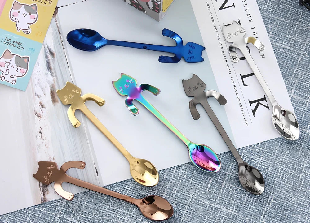 Stainless steel coffee spoon with cartoon cat handle design showing 11.7cm measurement scale