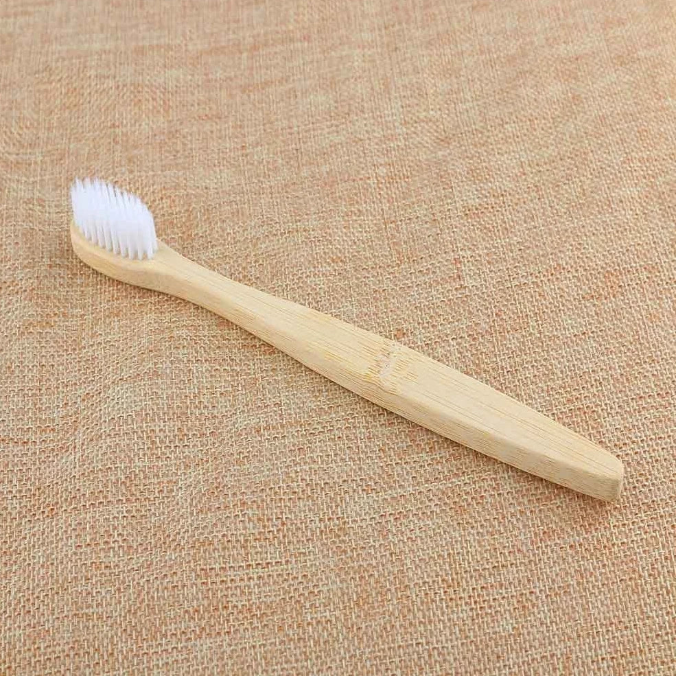 Organic bamboo toothbrush with 17.5cm ergonomic handle and charcoal-infused bristles for sustainable dental care