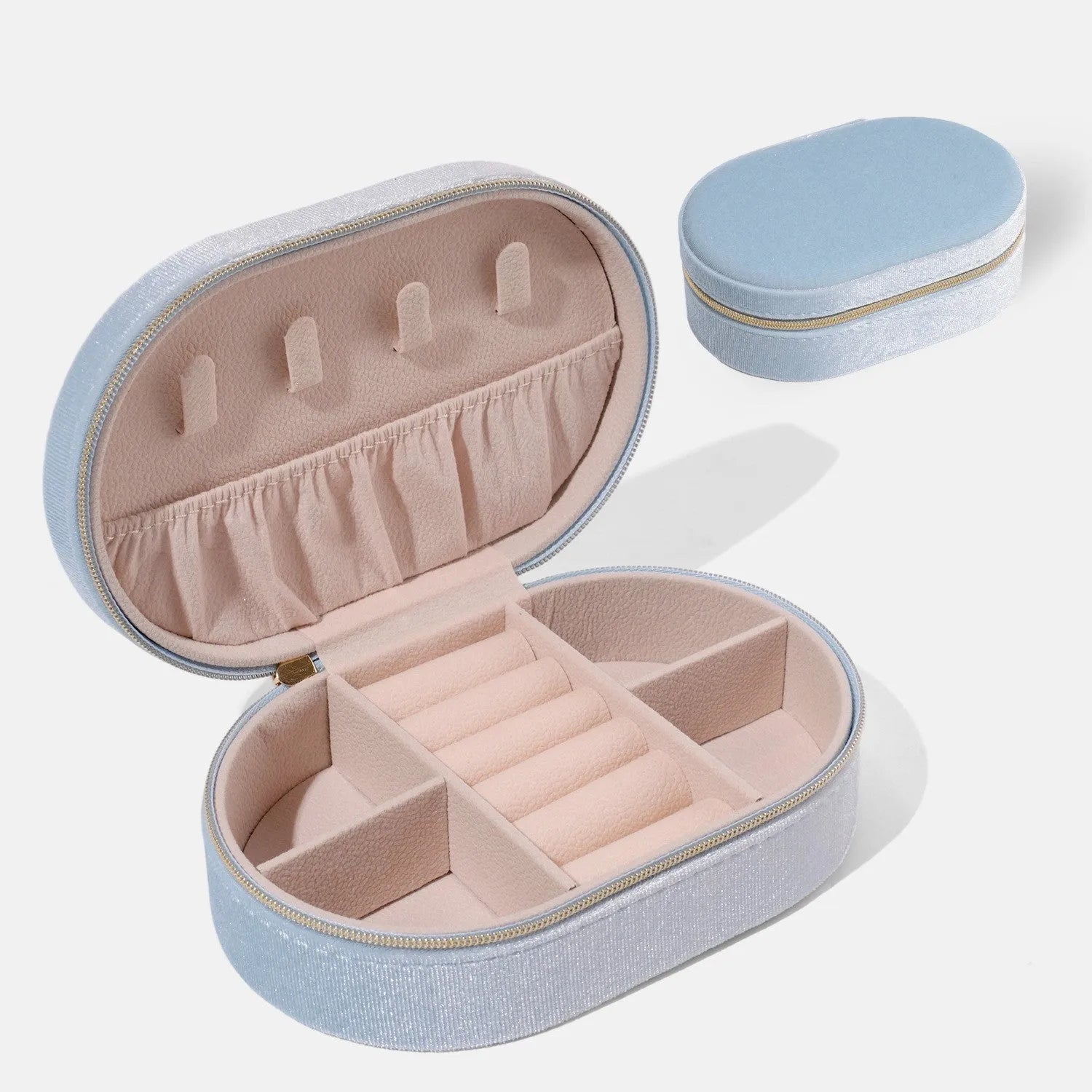 Oval velvet jewellery storage box with flannel lining in lake blue colour showing 15x10x5cm dimensions