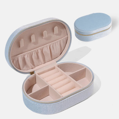 Oval velvet jewellery storage box with flannel lining in lake blue colour showing 15x10x5cm dimensions