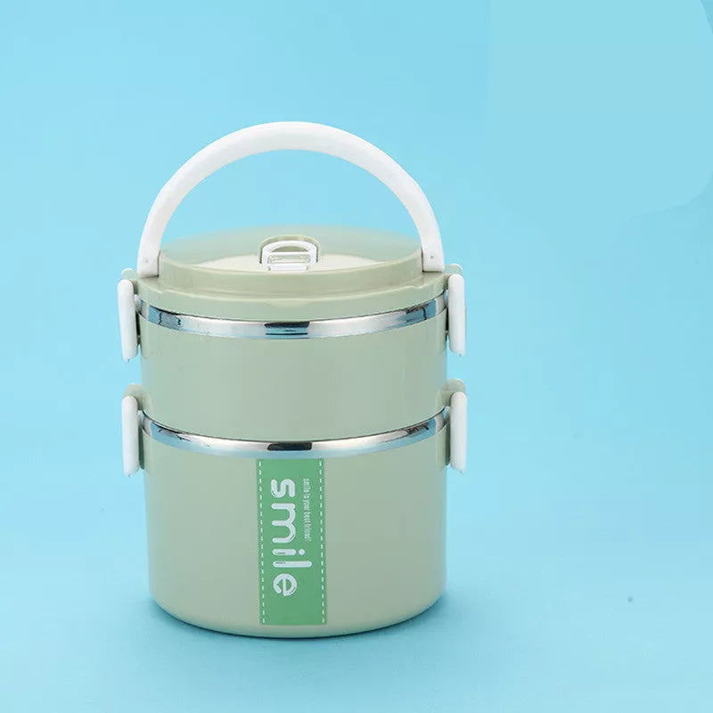 Stainless steel lunch box with built-in spoon, leak-proof design, available in green, pink, and blue