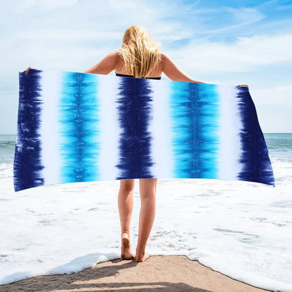 Square beach towel with tie-dye pattern showing superfine fibre texture and vibrant colours