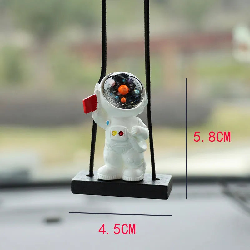 Colourful resin astronaut car pendant ornament with cartoon spaceman design on car dashboard