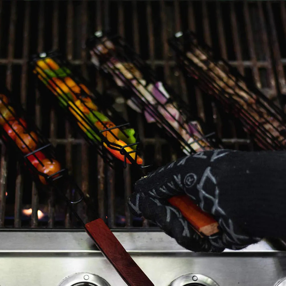 Barbecue basket with rotary lid and long wood handle on a grill, burlywood colour.