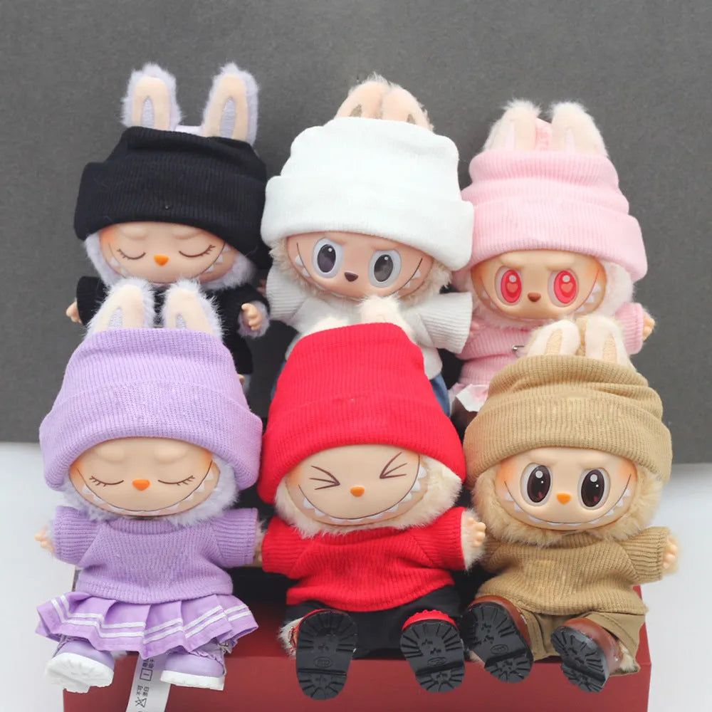 Doll clothes set with knitted flanging hat and T-shirt in multiple colours including pink, white, and stripes.