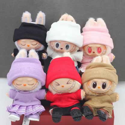 Doll clothes set with knitted flanging hat and T-shirt in multiple colours including pink, white, and stripes.