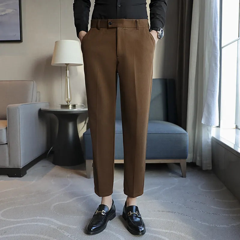 Straight-leg brown corduroy trousers with elastic waistband and slim fit design