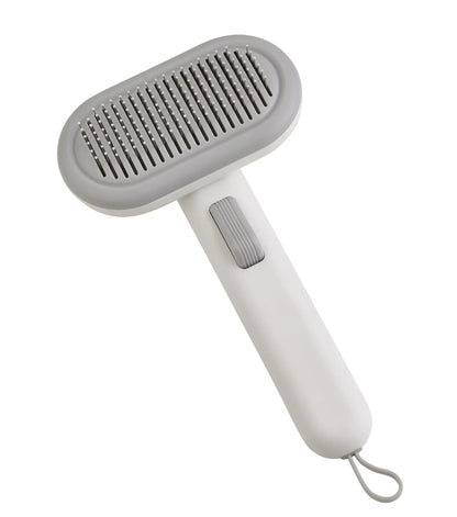 Large one-click pet hair removal and knot untying comb in light grey, showing stainless steel teeth.