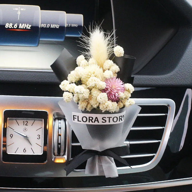 Mini dried flower bouquet mounted in car air vent for decorative aromatherapy