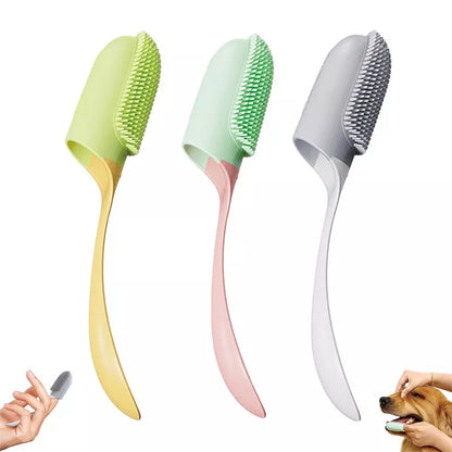 Silicone finger toothbrush for dogs and cats in pink, yellow, and white