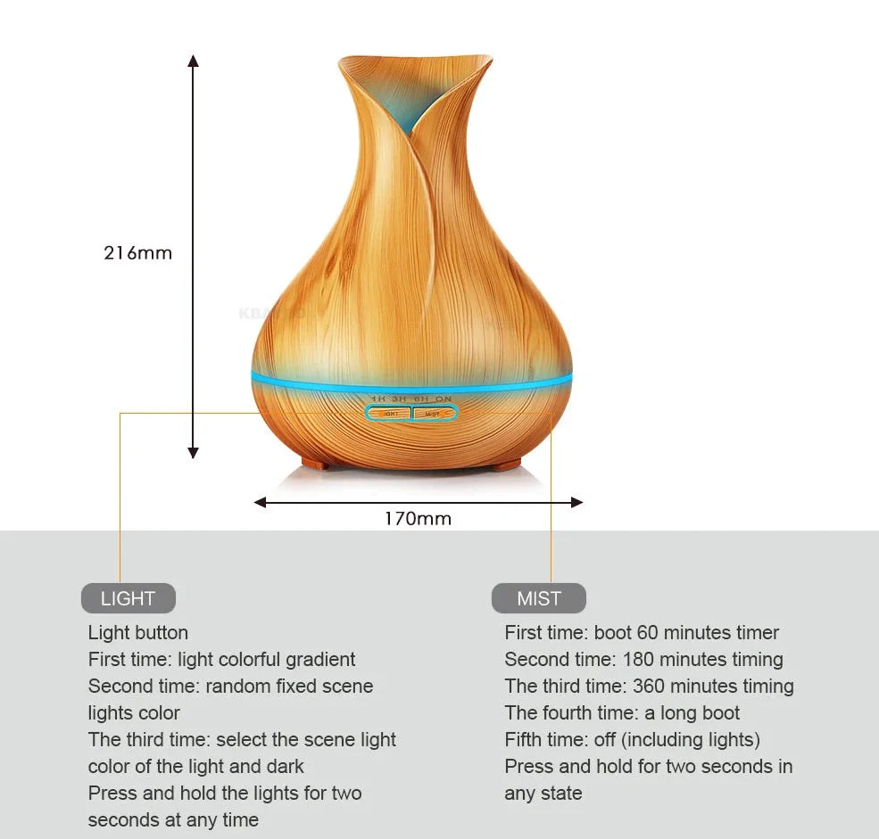 Black USB humidifier with colour-changing LED lights and water mist output, 15cm tall on wooden desk