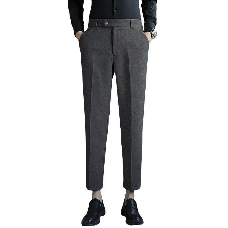 Straight-leg brown corduroy trousers with elastic waistband and slim fit design