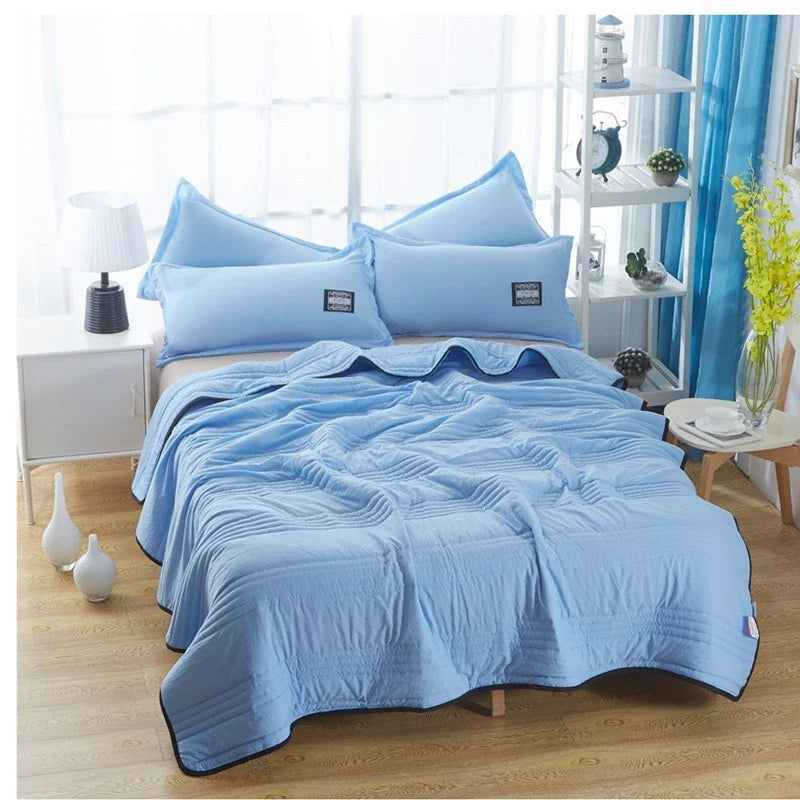 Lightweight, breathable cooling comforter in various colors and sizes for summer sleep comfort