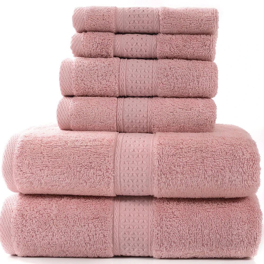 Cotton towel set showing bath towel, hand towel, and face cloth in coordinated sizes
