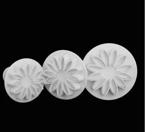 A set of premium cake decorating tools including plungers and knives for creating beautiful flower and shape designs on cakes and baked goods