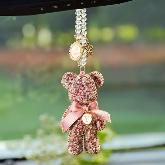 White artificial crystal rhinestone violent bear car rearview mirror pendant measuring 5x9cm.