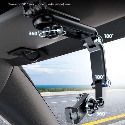 Grey and green car phone bracket with adjustable clip mounted on a car dashboard
