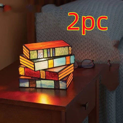Elegant vintage-inspired table lamp with stacked book design and handcrafted glass panels, creating a warm, ambient lighting solution for reading nooks and living spaces.